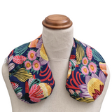 Colourful Australian floral neck heat pack filled with lupin seeds, worn across the shoulders for hot or cold therapy