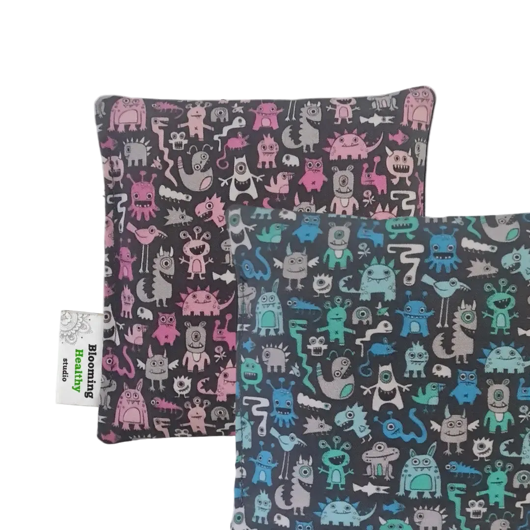 Handmade Kids Heat & Cold Pack featuring a mini monster print, filled with Australian-grown lupin seeds for natural relief from bumps, bruises and growing pains.