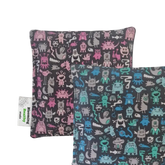 Handmade Kids Heat & Cold Pack featuring a mini monster print, filled with Australian-grown lupin seeds for natural relief from bumps, bruises and growing pains.