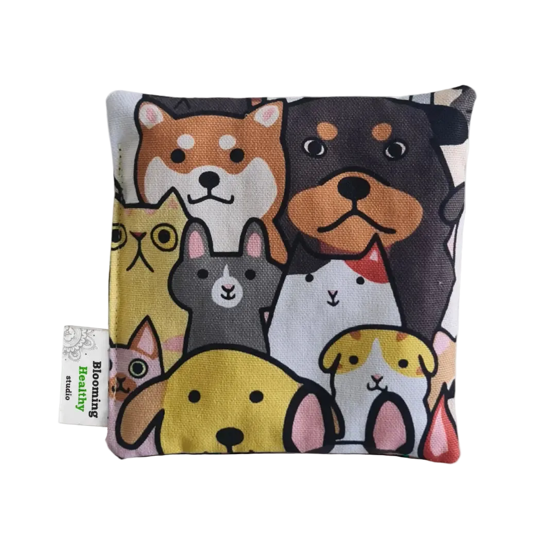 Handmade Kids Heat & Cold Pack featuring a cat-dog print, filled with Australian-grown lupin seeds for natural relief from bumps, bruises and growing pains.