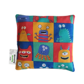 Handmade Kids Heat & Cold Pack featuring a happy monster print, filled with Australian-grown lupin seeds for natural relief from bumps, bruises and growing pains.