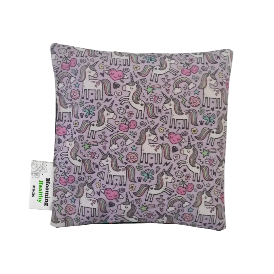 Handmade Kids Heat & Cold Pack featuring a tiny unicorn print, filled with Australian-grown lupin seeds for natural relief from bumps, bruises and growing pains.