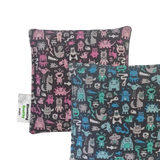 Handmade Kids Heat & Cold Pack featuring a mini monster print, filled with Australian-grown lupin seeds for natural relief from bumps, bruises and growing pains.
