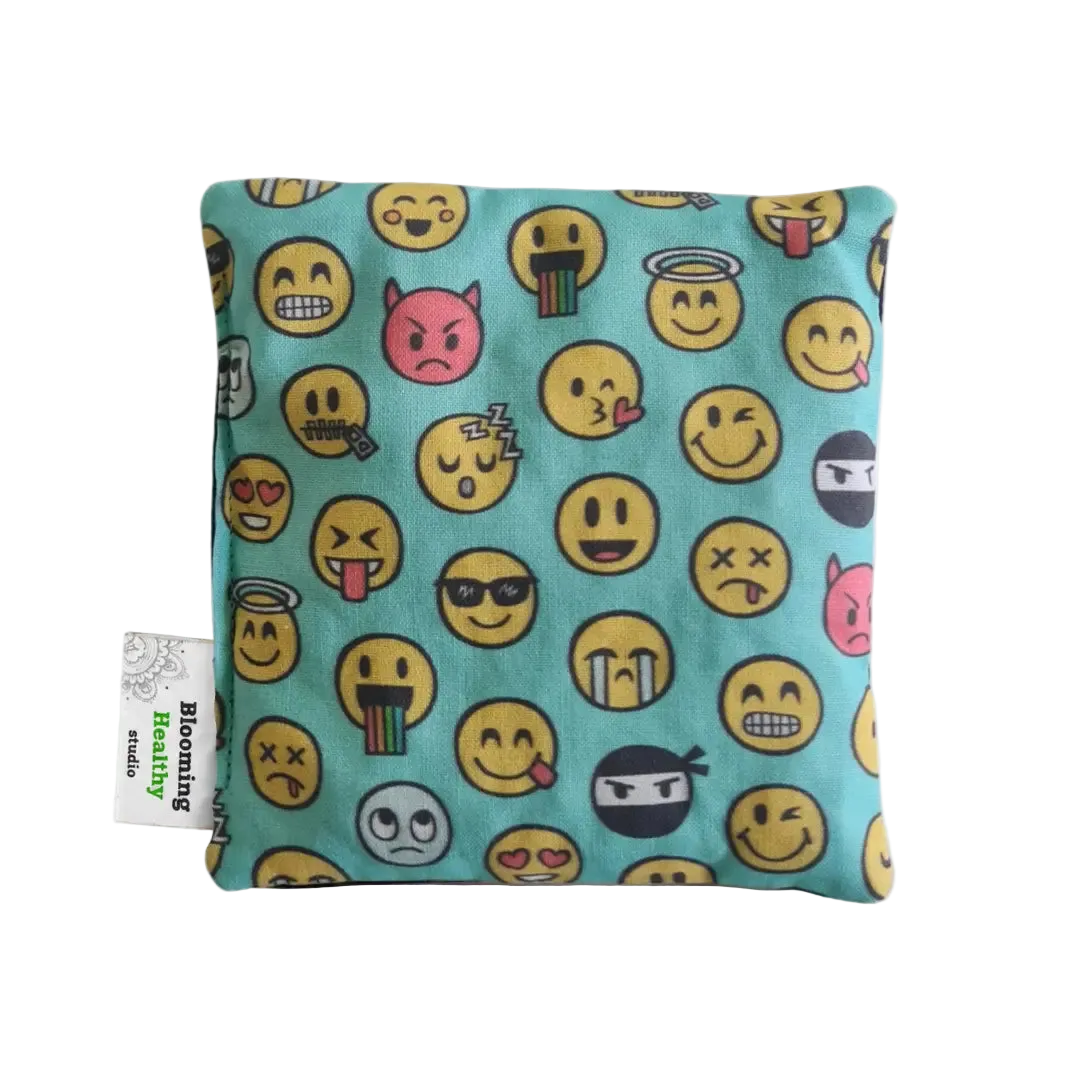 Handmade Kids Heat & Cold Pack featuring a emoji print, filled with Australian-grown lupin seeds for natural relief from bumps, bruises and growing pains.