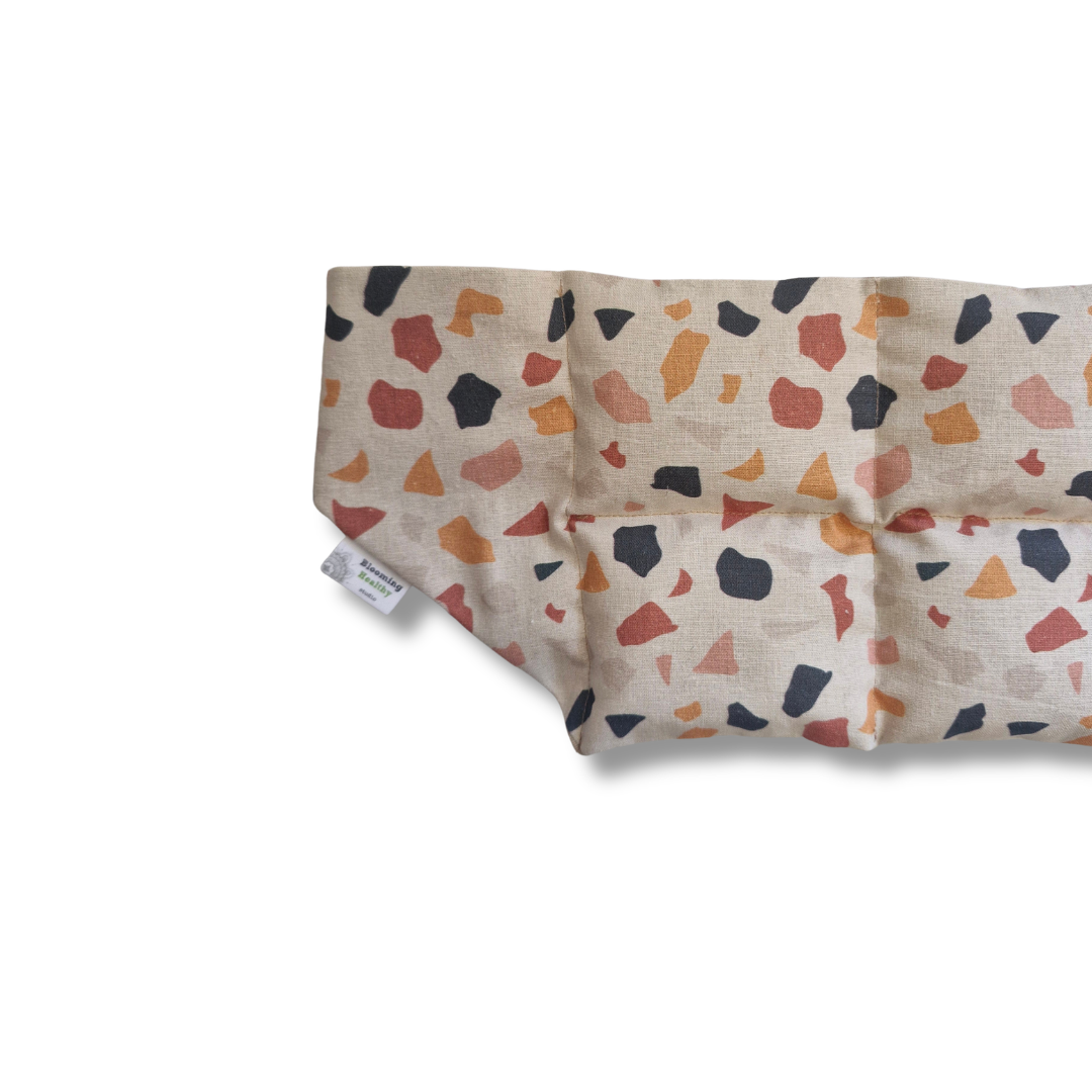 Leopard Confetti lupin seed wearable heat and cold wrap in colourful abstract animal print cotton fabric layed flaat