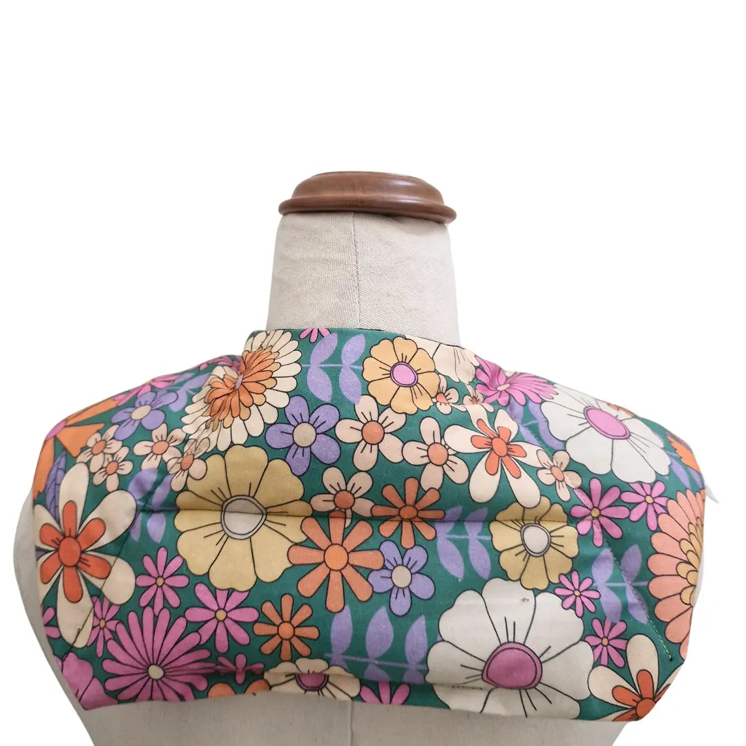 Retro Bloom lupin seed neck heat and cold pack worn around the shoulders back view