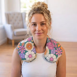 Retro Bloom lupin seed neck heat and cold pack worn around the shoulders front view